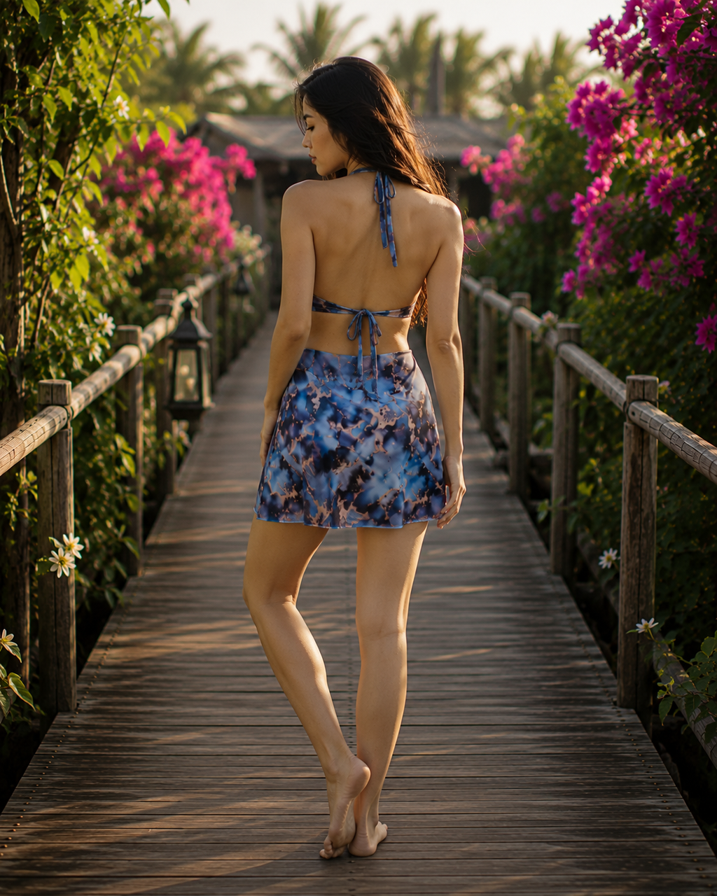 The Nyvra Azure Breeze blue halter mini skirt displayed on a hanger, showcasing its vibrant color and stylish design.