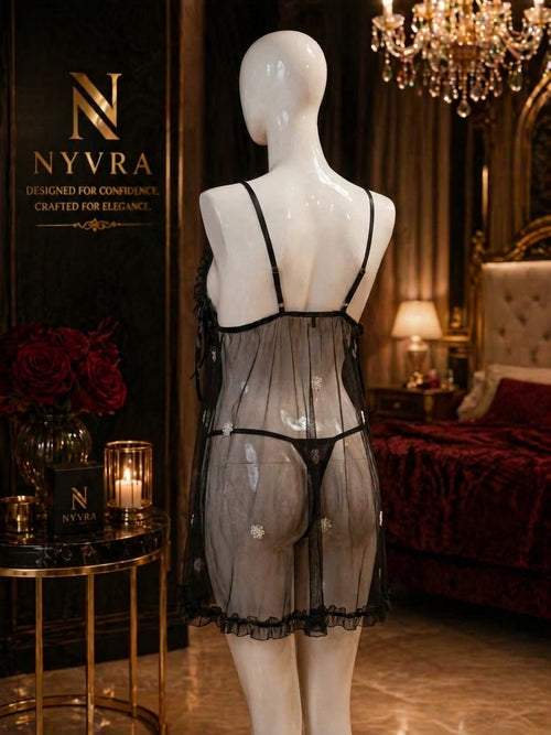Close-up of a perfume bottle labeled Irresistible -Starts Here by The Nyvra, with elegant packaging and a sleek design.